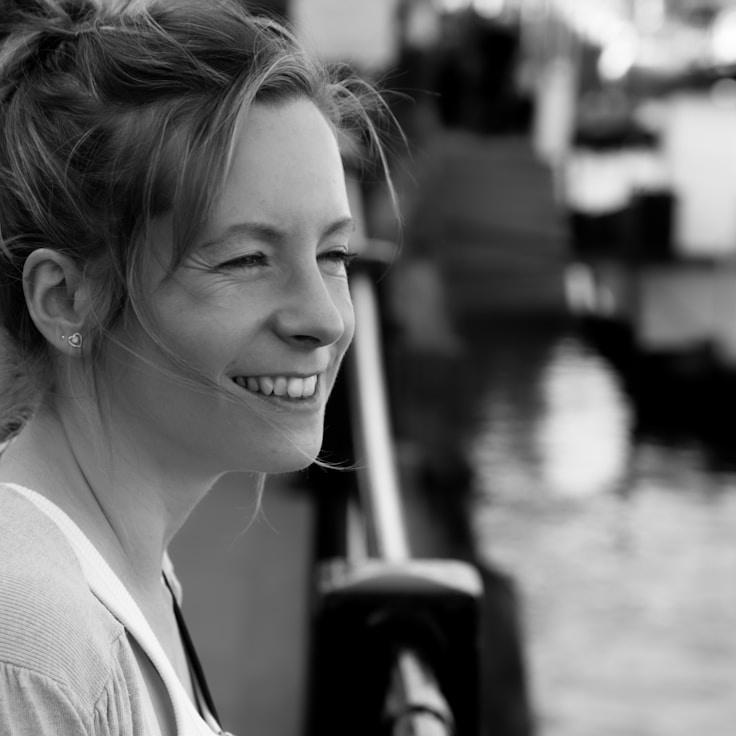 Kaveri Mehta, Lead Design Curator at Garden Pastel Window, reviewing corporate floral arrangements